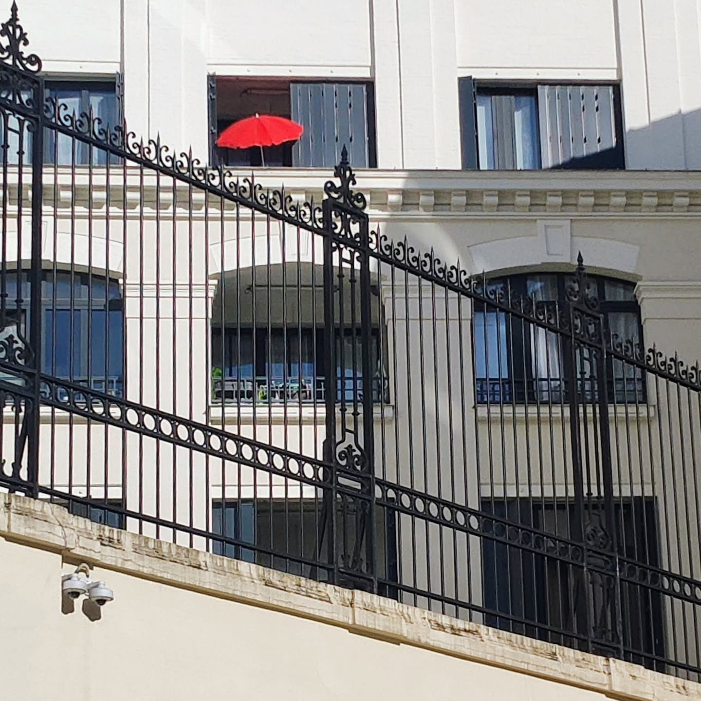 Red Umbrella Poking Out Across From The Google France Office
